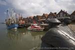 The quaint harbour in the town of Neuharlingersiel along the coast of the North Sea in Germany, Europe.