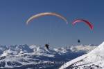 A couple of paragliders view the alps of Austria from the top.
