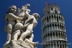 The world famous Leaning Tower of Pisa and a statue of angels in Tuscany, Italy, Europe.