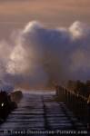 The treacherous stormy waters of the North Sea pummel the pier in the town of Vorupoer along Denmark's west coast.