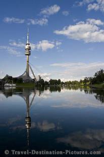 The tower reflects in a pool at The Olympic Park of Munich, Germany, Europe.